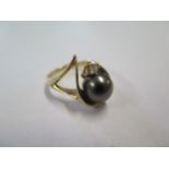 A 14ct gold ring inset with Thai Haitian pearl and diamond, stamped 14K, weight approx 6.6 grams,