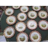 Seventeen late 19th century porcelain plates, probably Spode, each hand painted with landscape