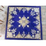 A late 20th century needlework panel, gilt and silver foliate design against a blue velvet ground,
