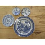 A Chinese blue and white porcelain plate, 23cm diameter, chips to rim otherwise good, two saucers