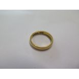 A 22ct gold hallmarked band ring, size N, approx 4.9 grams engraved to inner shank, some usage wear