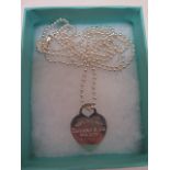 A Tiffany and Co.925 sterling silver heart tag pendant on a 34inch chain, boxed, approx weight 0.