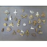 A collection of assorted military badges