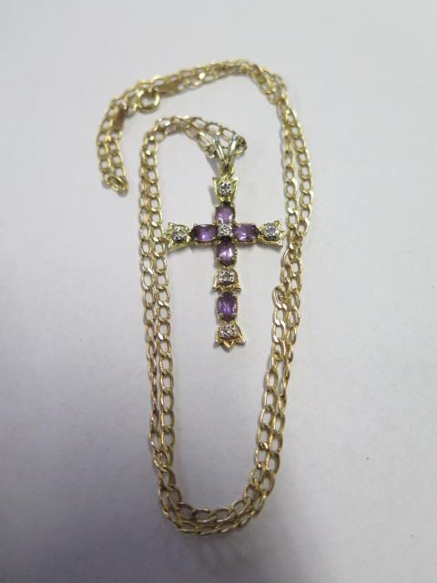A 9ct gold crucifix pendant and chain inset with diamond and amethyst, overall weight approx 3.8 - Image 3 of 3