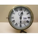 A brass cased ship's wall clock by Lilley and Reynolds Ltd, London E.C.3, slow/fast adjustment and