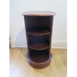 A mahogany round bookcase with leather top, 73cm tall x 39cm diameter, generally good condition