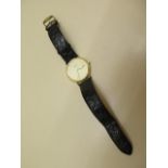 A gents Longines gold plated quartz wristwatch with date, case 32mm wide, no: L4 720.2, with leather