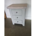 A painted three drawer bedside chest with a chalked oak top, 62cm high x 47cm wide, ex-display as
