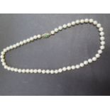A string of pearls with a 9ct gold clasp, 48cm long, pearls approx 7mm in diameter, in good
