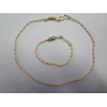 A pearl necklace, approx 44cm long and a pearl bracelet, approx 19cm long, both with gilt clasps