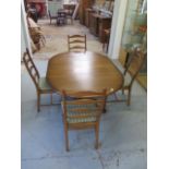 An Ercol elm oval extending dining table and 4 chairs with seat pads, 74cm tall x 166cm x 114cm