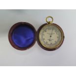 A Negretti and Zambra compensated pocket barometer, no 18926, 5cm diameter with outer case, in