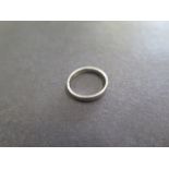 A 950 hallmarked platinum band ring, size I, approx 1.9 grams, some marks consistent with use