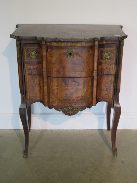 A French 19th century two drawer chest with marble top over a shaped marquetry inlaid base comprised