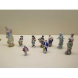 Nine miniature porcelain figures, the tallest 13cm, numerous losses, repairs and damages