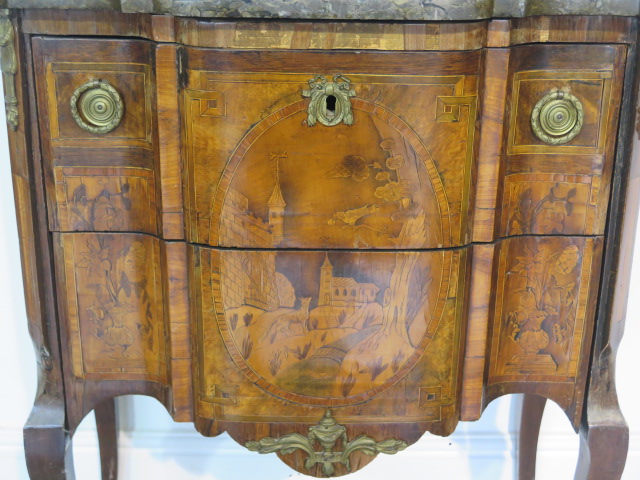 A French 19th century two drawer chest with marble top over a shaped marquetry inlaid base comprised - Image 3 of 10