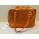 A Marina Rinaldi orange quilted leather bag with inside pocket from Harrods, retail price £309, 34cm