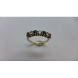 A hallmarked 9ct yellow gold diamond and sapphire seven stone ring size O, approx 2.7gs, generally