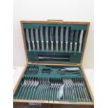 A Walker and Hall silver plated flatware service contained in an oak case, 49cm wide, age related