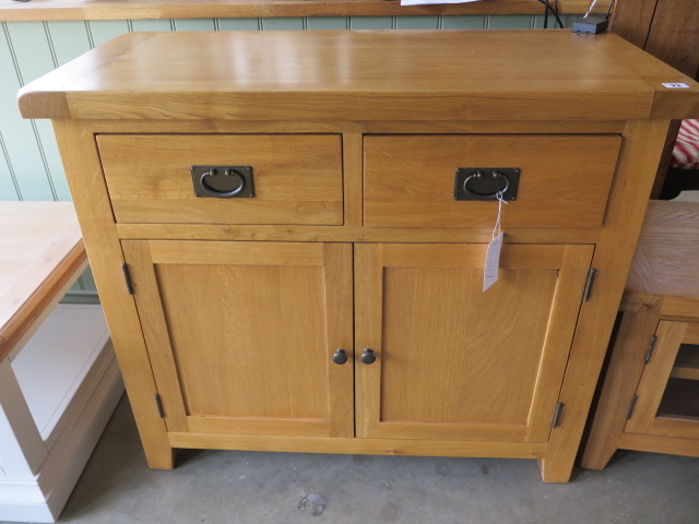 A oak sideboard with 2 drawers and 2 cupboard doors, as new, 100cm wide x 88cm high x 45cm deep