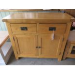 A oak sideboard with 2 drawers and 2 cupboard doors, as new, 100cm wide x 88cm high x 45cm deep