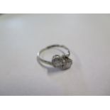 An 18ct white gold and platinum two stone diamond ring, marked 88 18ct PLAT, ring size O, approx 2.2