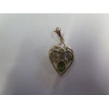 A 9ct gold and peridot heart shaped pendant, tests to 9ct, 36mm drop, approx weight 3.8 grams, minor