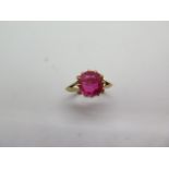 An 18ct yellow gold Corundum single stone ring, size M, head approx 8mm, marked 18ct, approx 3.8