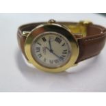 A Cartier gold plated wristwatch 'Must de Cartier' with date aperture and brown leather strap in a