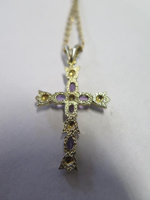 A 9ct gold crucifix pendant and chain inset with diamond and amethyst, overall weight approx 3.8 - Image 2 of 3