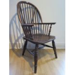 An ash and elm stick back Windsor chair, stamped 1937 to the underside, 106cm high, general age