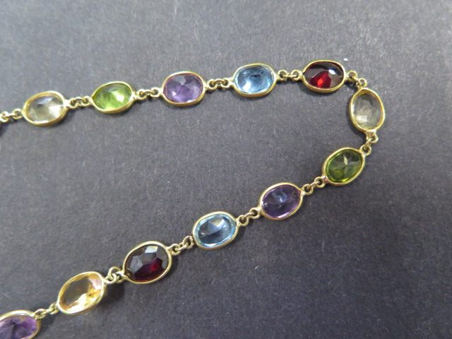 An 18ct yellow gold multigem sapphire, garnet, citrine, peridot necklace, approx 72cms long, total - Image 2 of 4
