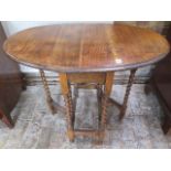 A 1930's oak barleytwist dropleaf side table, 71cm tall x 60cm x 90cm
