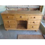 A Victorian stripped, waxed and restored seven drawer dresser base, 88cm high x 152cm x 49cm