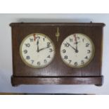 A 1920s large wooden chess clock, made in Germany and containing a Hamburg and American Clock