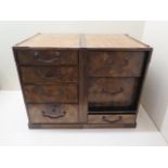 An oriental wooden jewellery chest of seven drawers, 28cm tall x 36cm x 25cm