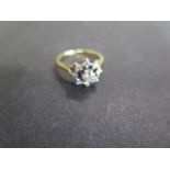 A hallmarked 18ct gold platinum and diamond cluster ring, size O, diamonds bright, hallmarks worn,