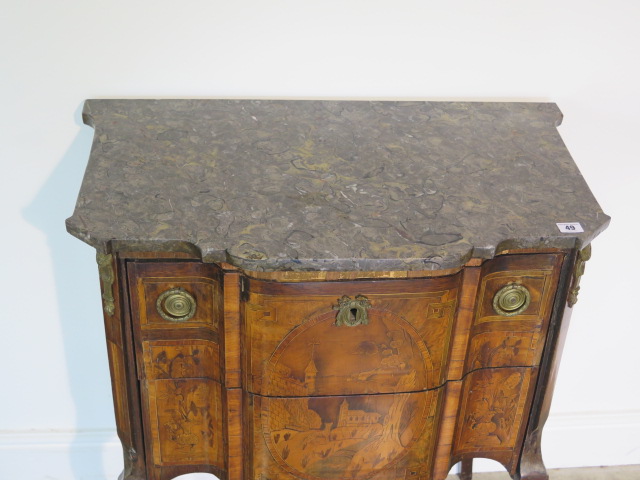 A French 19th century two drawer chest with marble top over a shaped marquetry inlaid base comprised - Image 2 of 10