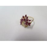 A 9ct yellow gold ruby flower spray ring, hallmarked, size R, approx 4.2 grams, in good condition