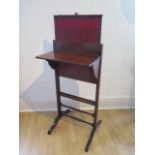 A 19th century rosewood screen with folding leaf, 41cm wide frame x 82cm tall, fabric worn