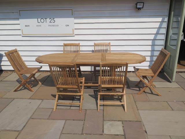A new teak garden table and 6 folding chairs. Table size extends from 180cm to 240cm with single