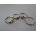 Four rings comprising 18ct and platinum (2) and a platinum and a 10ct white gold ring, sizes L, K, K