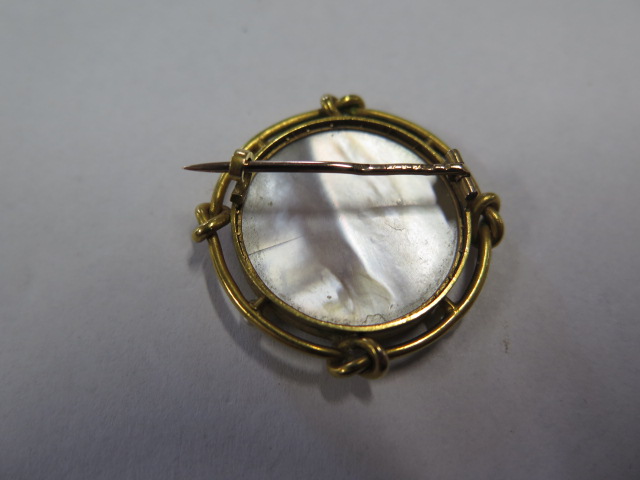 A French gold mounted 18ct miniature set with 4 small pearls and a mother of pearl back, 3cm - Image 2 of 2