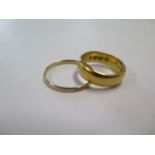 A 22ct yellow gold hallmarked band ring, size O, approx 8 grams, and another ring unhallmarked but