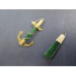 A yellow metal mounted jade pendant and a yellow metal mounted jade anchor, 5cm long, total weight