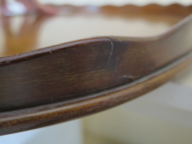 An early 1900s mahogany oval twin handle tray with a shaped rim, 71cm x 58cm - Image 4 of 4