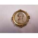 A French gold mounted 18ct miniature set with 4 small pearls and a mother of pearl back, 3cm
