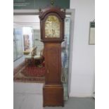 An early 19th century 8 day oak longcase clock by WM East of Bury St.Edmunds, 12" arched brass