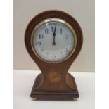 An 8 day mahogany case balloon mantle clock with inlay, 23cm tall, running in saleroom