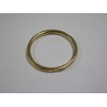 A yellow gold bangle tests to approx 18ct, approx 19.8 grams, 7.5cm external diameter, dented and